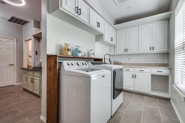 286 Lilac Ln, Southlake, TX 76092 - laundry area with washer and dryer and cabinet space