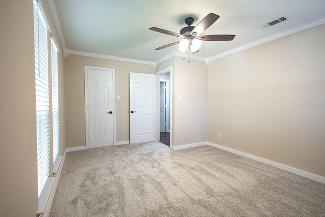 4701 Woodview St, Arlington, TX 76013 - unfurnished bedroom with crown molding, multiple windows, carpet flooring, baseboards, and ceiling fan