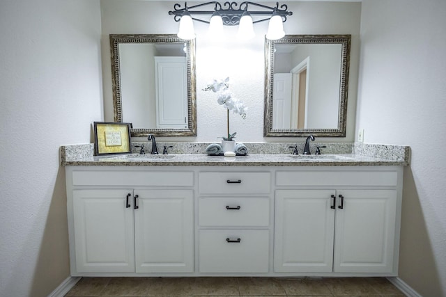 4701 Woodview St, Arlington, TX 76013 - bathroom featuring double vanity and baseboards