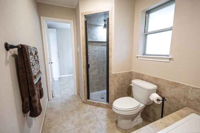 4701 Woodview St, Arlington, TX 76013 - full bath with toilet, a shower stall, tile patterned flooring, and tile walls