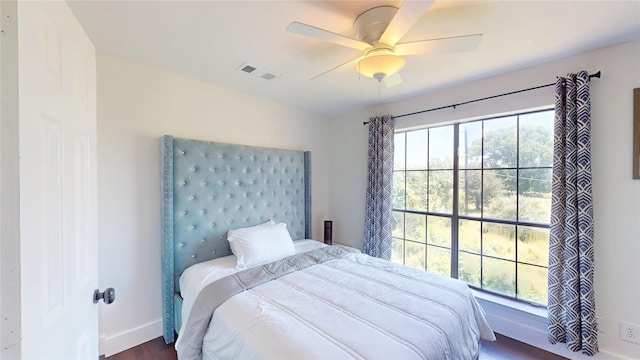 903 Turtle Lake Blvd Unit 268, Irving, TX 75060 - bedroom with wood finished floors, a ceiling fan, and baseboards