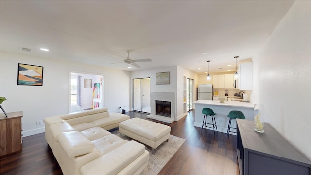 903 Turtle Lake Blvd Unit 268, Irving, TX 75060 - living area with recessed lighting, dark wood finished floors, a ceiling fan, baseboards, and a fireplace