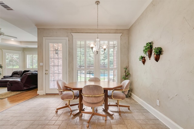 808 Country Club Dr, Heath, TX 75032 - dining space with a chandelier, baseboards, ornamental molding, and light stone finish flooring