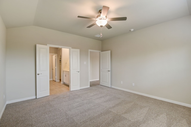 944 Linden Ct, Lavon, TX 75166 - unfurnished bedroom featuring light colored carpet, baseboards, vaulted ceiling, a ceiling fan, and ensuite bath