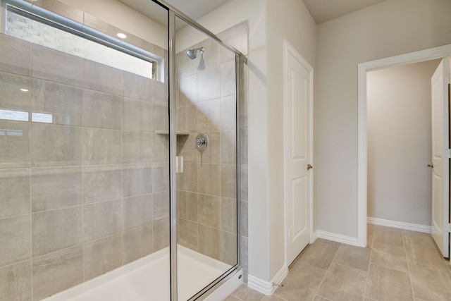 944 Linden Ct, Lavon, TX 75166 - full bath with a tile shower, baseboards, and tile patterned flooring
