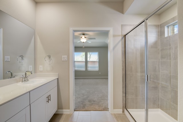 944 Linden Ct, Lavon, TX 75166 - bathroom with vanity, a ceiling fan, a shower stall, and tile patterned flooring