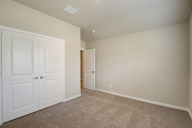 944 Linden Ct, Lavon, TX 75166 - unfurnished bedroom with carpet floors, baseboards, a closet, and vaulted ceiling