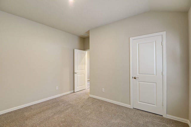 944 Linden Ct, Lavon, TX 75166 - unfurnished bedroom with light carpet, baseboards, and lofted ceiling