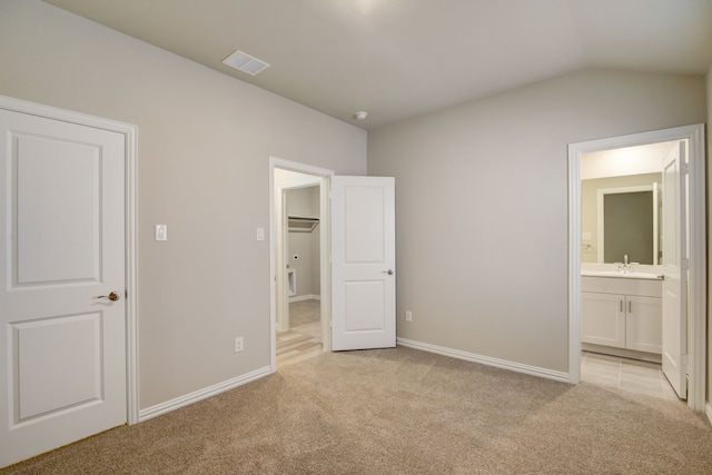 944 Linden Ct, Lavon, TX 75166 - unfurnished bedroom featuring light carpet, a sink, connected bathroom, lofted ceiling, and baseboards