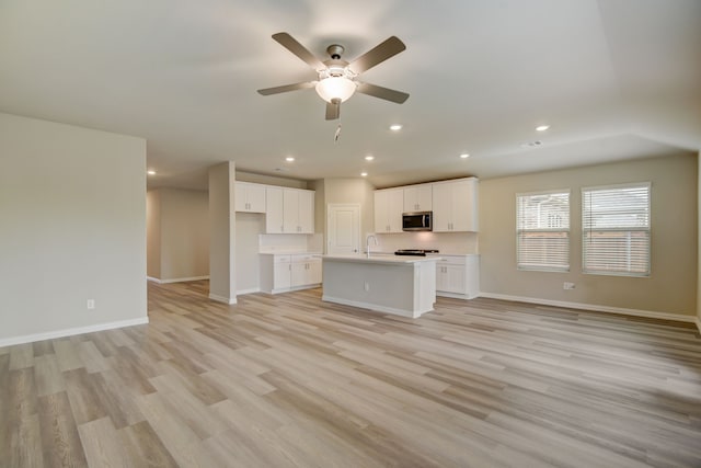 944 Linden Ct, Lavon, TX 75166 - unfurnished living room with light wood-type flooring, a ceiling fan, baseboards, and recessed lighting