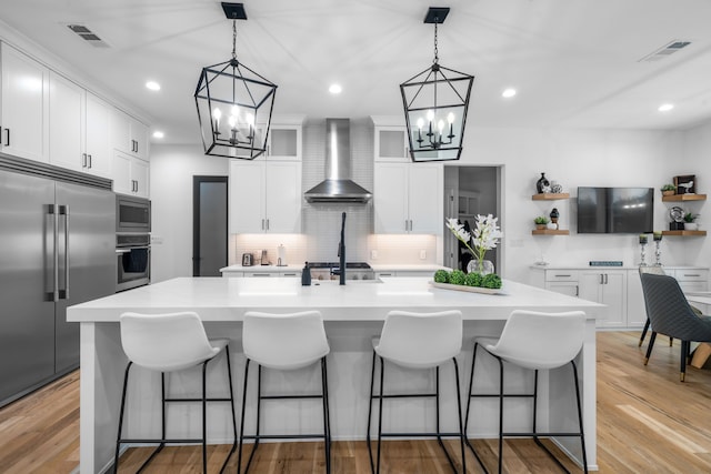 4940 Golden Bell Ln, Midlothian, TX 76065 - kitchen featuring wall chimney range hood, a chandelier, built in appliances, open shelves, and recessed lighting