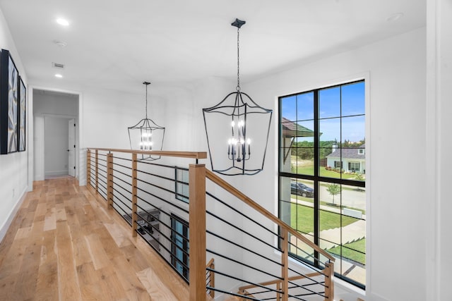 4940 Golden Bell Ln, Midlothian, TX 76065 - hallway featuring a chandelier, an upstairs landing, light wood-style floors, recessed lighting, and baseboards
