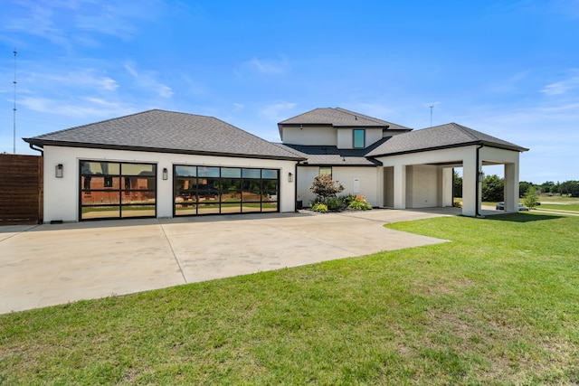 4940 Golden Bell Ln, Midlothian, TX 76065 - rear view of property featuring driveway, a shingled roof, a garage, and stucco siding
