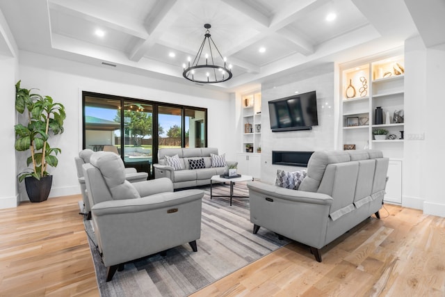 4940 Golden Bell Ln, Midlothian, TX 76065 - living area with a chandelier, light wood-style flooring, baseboards, a fireplace, and beam ceiling