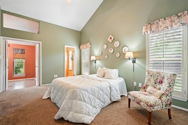 7934 Bonnie Cir, Abilene, TX 79606 - carpeted bedroom featuring multiple windows, high vaulted ceiling, baseboards, and a ceiling fan
