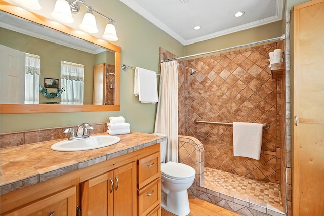 7934 Bonnie Cir, Abilene, TX 79606 - full bath with toilet, vanity, a tile shower, crown molding, and wood finished floors