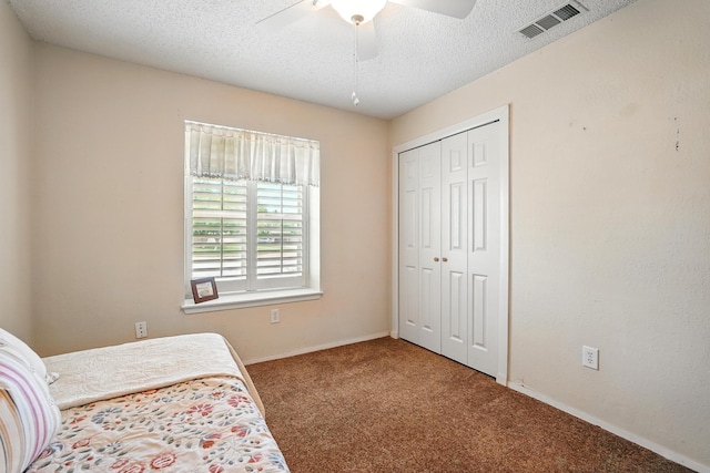 7934 Bonnie Cir, Abilene, TX 79606 - bedroom with carpet floors, a closet, a textured ceiling, baseboards, and a ceiling fan