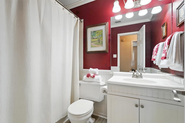 7934 Bonnie Cir, Abilene, TX 79606 - full bathroom with toilet, a wainscoted wall, vanity, ornamental molding, and a shower with shower curtain
