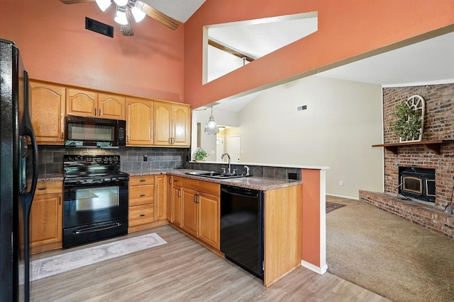7934 Bonnie Cir, Abilene, TX 79606 - kitchen with black appliances, a sink, lofted ceiling, a ceiling fan, and tasteful backsplash