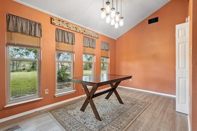 7934 Bonnie Cir, Abilene, TX 79606 - dining space with light wood-style flooring, high vaulted ceiling, baseboards, and a chandelier