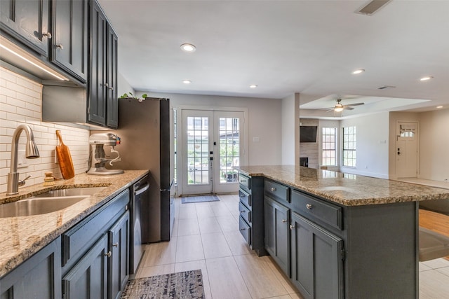 14815 Surveyor Blvd, Addison, TX 75001 - kitchen with a sink, tasteful backsplash, recessed lighting, dishwasher, and a kitchen island