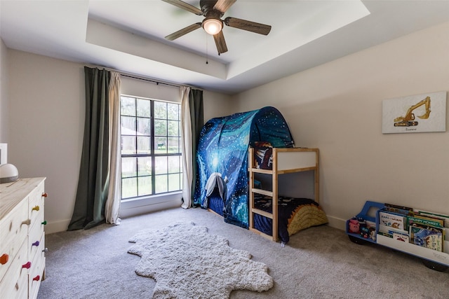 14815 Surveyor Blvd, Addison, TX 75001 - bedroom featuring carpet, a raised ceiling, and ceiling fan