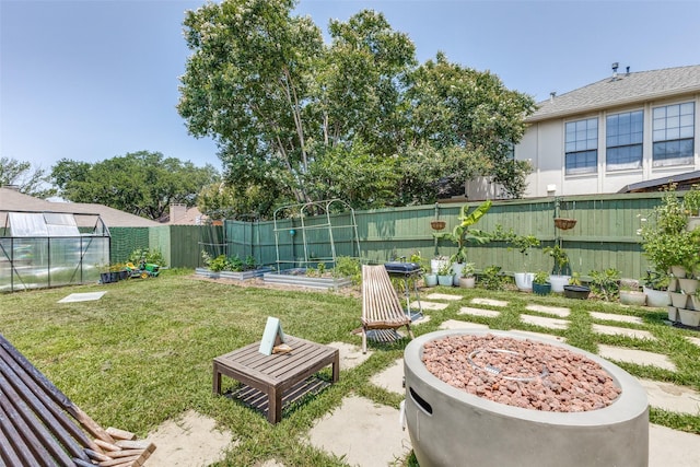 14815 Surveyor Blvd, Addison, TX 75001 - view of yard featuring a garden, a greenhouse, and an outdoor structure