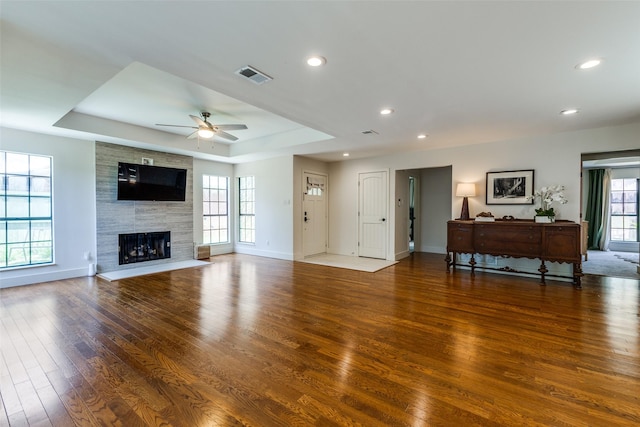 14815 Surveyor Blvd, Addison, TX 75001 - living room with wood finished floors, ceiling fan, a raised ceiling, baseboards, and recessed lighting