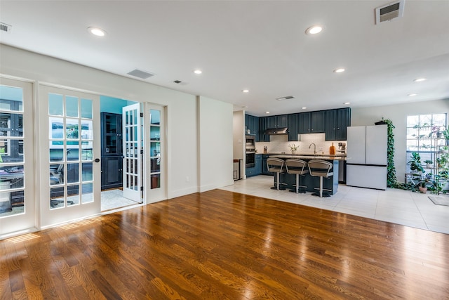 14815 Surveyor Blvd, Addison, TX 75001 - living area with light wood finished floors and recessed lighting