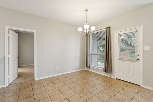 13100 Larks View Pt, Fort Worth, TX 76244 - unfurnished dining area with a chandelier, light tile patterned floors, and baseboards