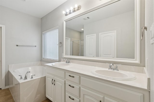 13100 Larks View Pt, Fort Worth, TX 76244 - full bathroom featuring double vanity, a garden tub, and a stall shower