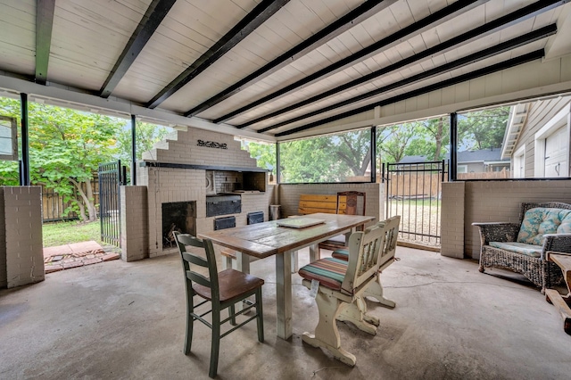 306 W Ross St, Waxahachie, TX 75165 - sunroom featuring a brick fireplace, outdoor dining space, and beamed ceiling
