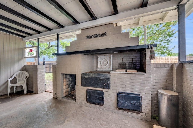 306 W Ross St, Waxahachie, TX 75165 - living room featuring unfinished concrete flooring and an outdoor fireplace
