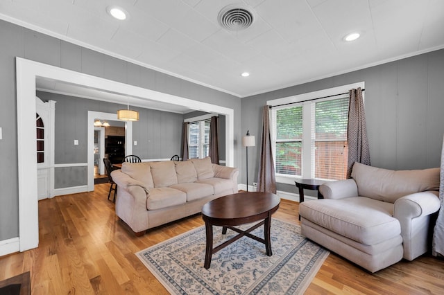 306 W Ross St, Waxahachie, TX 75165 - living room featuring crown molding, light wood finished floors, a decorative wall, baseboards, and recessed lighting