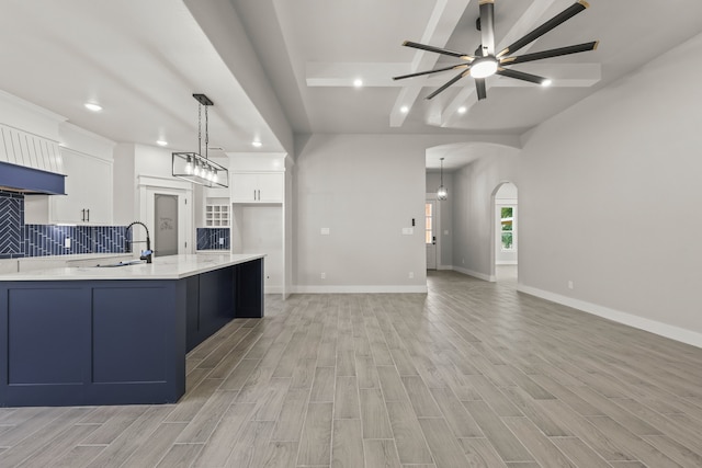 3813 Galvez Ave, Fort Worth, TX 76111 - kitchen featuring recessed lighting, a ceiling fan, a sink, light countertops, and white cabinets