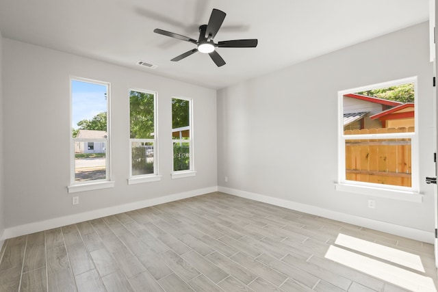 3813 Galvez Ave, Fort Worth, TX 76111 - empty room featuring a ceiling fan, baseboards, and light wood finished floors