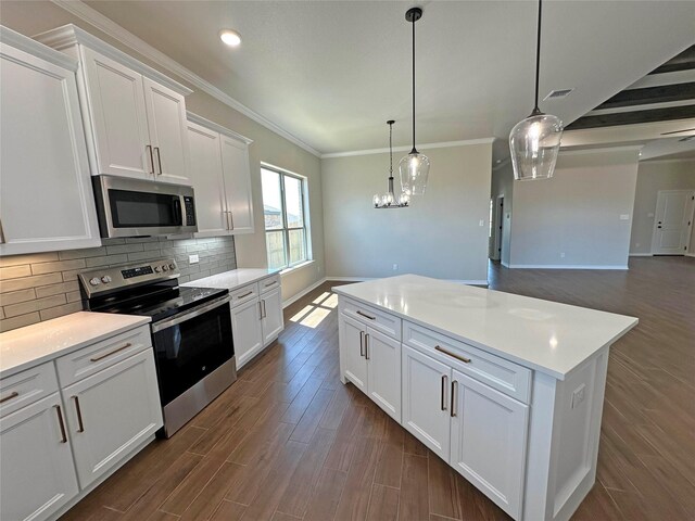 507 Magnolia Dr, Troy, TX 76579 - kitchen with appliances with stainless steel finishes, decorative backsplash, dark wood-style floors, baseboards, and white cabinetry