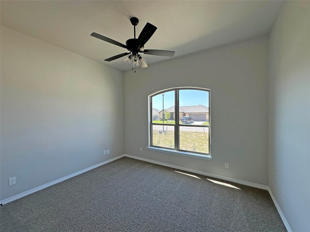 507 Magnolia Dr, Troy, TX 76579 - spare room with dark carpet, baseboards, and a ceiling fan