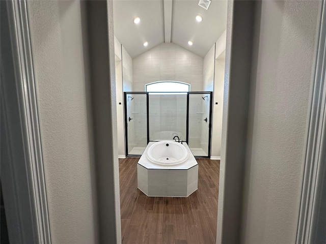 507 Magnolia Dr, Troy, TX 76579 - bathroom featuring a garden tub, a shower stall, lofted ceiling, wood finished floors, and a textured wall