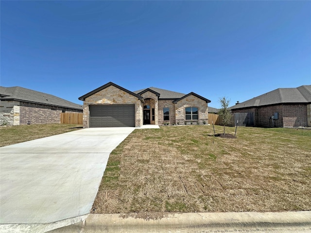 507 Magnolia Dr, Troy, TX 76579 - french country style house with driveway, a garage, and stone siding
