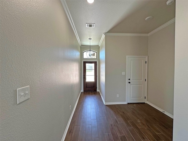507 Magnolia Dr, Troy, TX 76579 - doorway to outside with baseboards, ornamental molding, dark wood-type flooring, and a textured ceiling