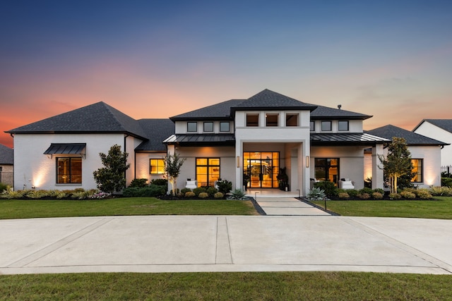 4309 American Pharoah Way, Celina, TX 75009 - view of front facade with a standing seam roof, metal roof, a lawn, and a shingled roof