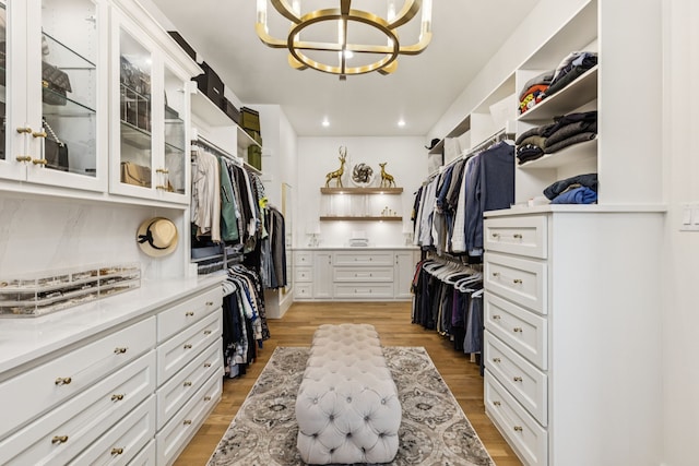 4309 American Pharoah Way, Celina, TX 75009 - spacious closet with light wood-style floors and a chandelier