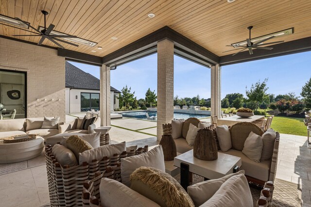4309 American Pharoah Way, Celina, TX 75009 - back of house with an outdoor kitchen, a patio, a ceiling fan, a lawn, and a pool with connected hot tub