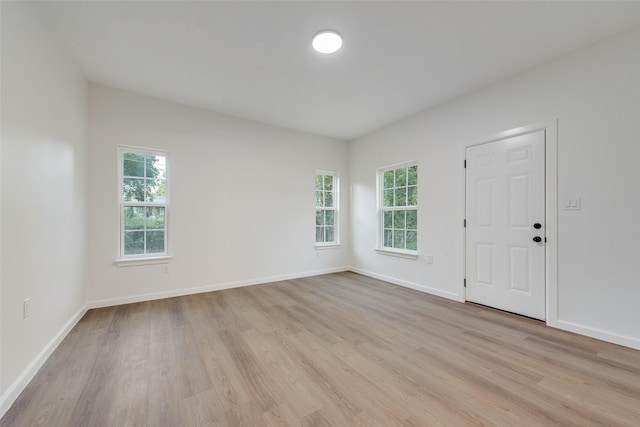 1113 Verbena St, Fort Worth, TX 76104 - foyer with light wood-style floors, plenty of natural light, and baseboards