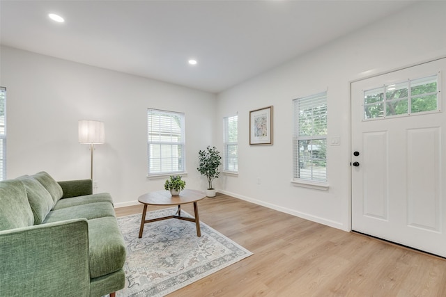 1113 Verbena St, Fort Worth, TX 76104 - living room with light wood-style flooring, recessed lighting, and baseboards