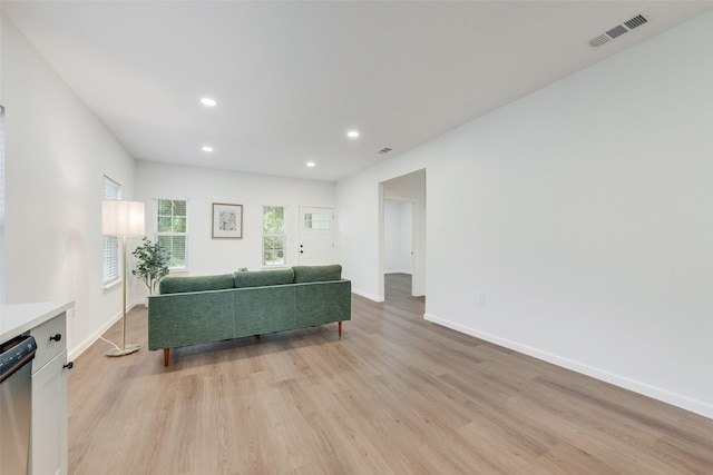 1113 Verbena St, Fort Worth, TX 76104 - living area with light wood-style floors, baseboards, and recessed lighting