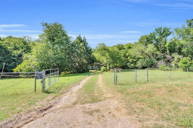 933 El Camino Rd, Waxahachie, TX 75167 - view of dirt / gravel road with a gate and a gated entry