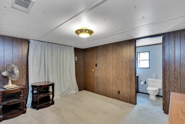 933 El Camino Rd, Waxahachie, TX 75167 - basement featuring carpet floors and wooden walls