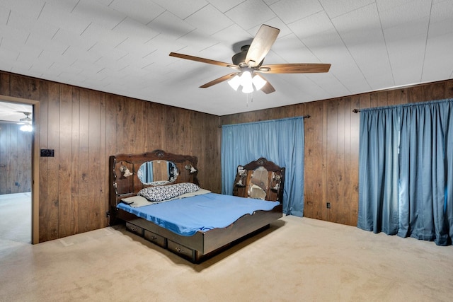 933 El Camino Rd, Waxahachie, TX 75167 - bedroom with carpet floors, wood walls, and ceiling fan